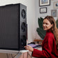 Woman in a red sweater adjusting the speed on her Tempest Pro air purifier.