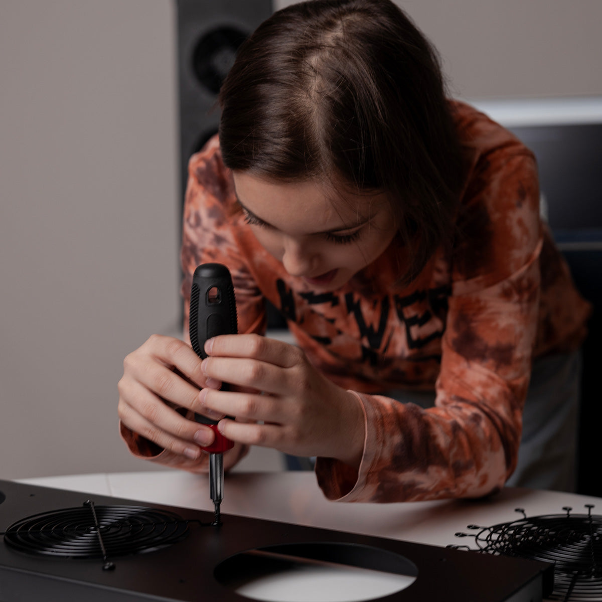 Young boy building a Tempest Pro air purifier.